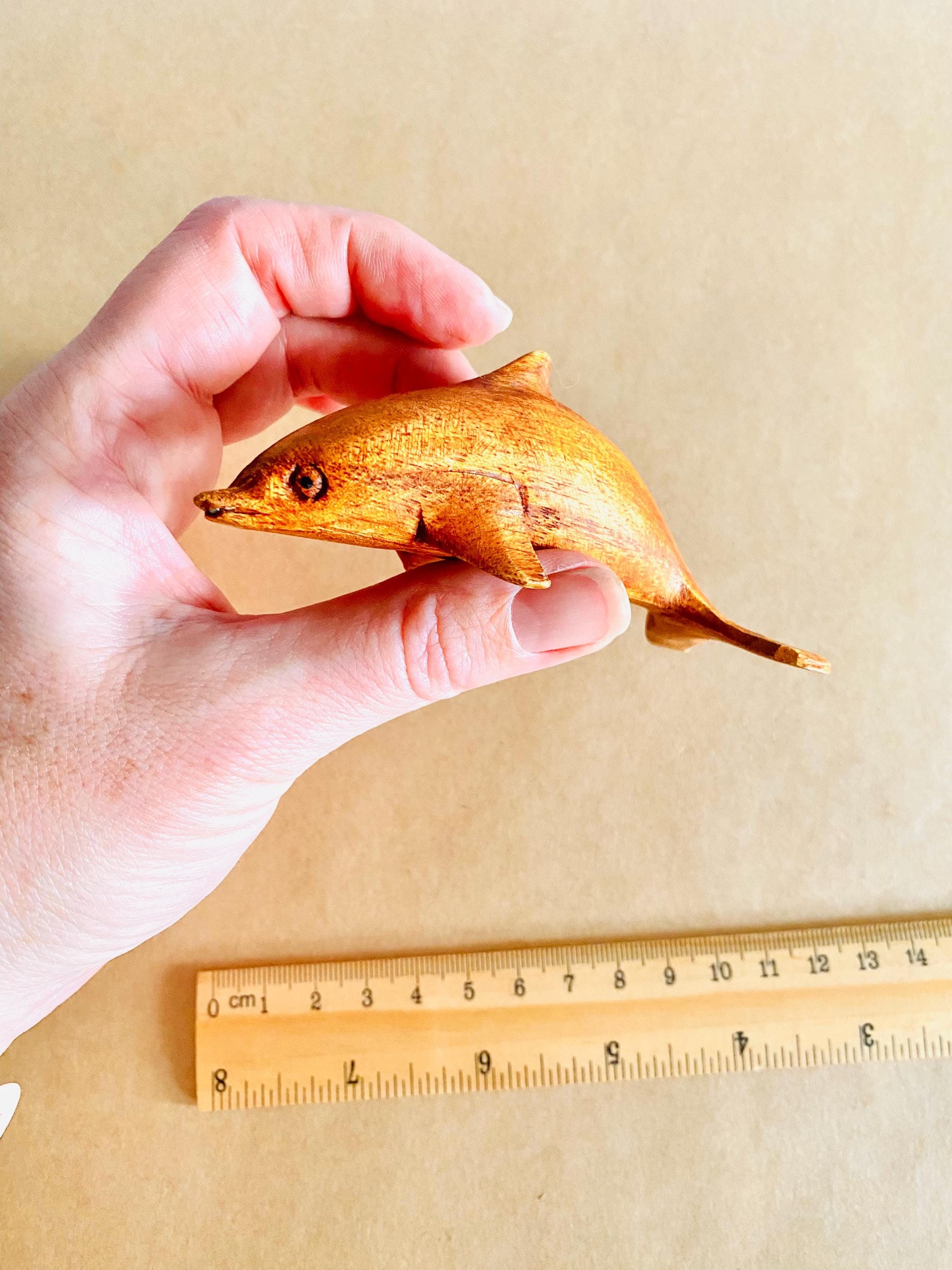 Eco-friendly 11cm wooden dolphin figurine, perfect as sustainable decor or a playful toy.