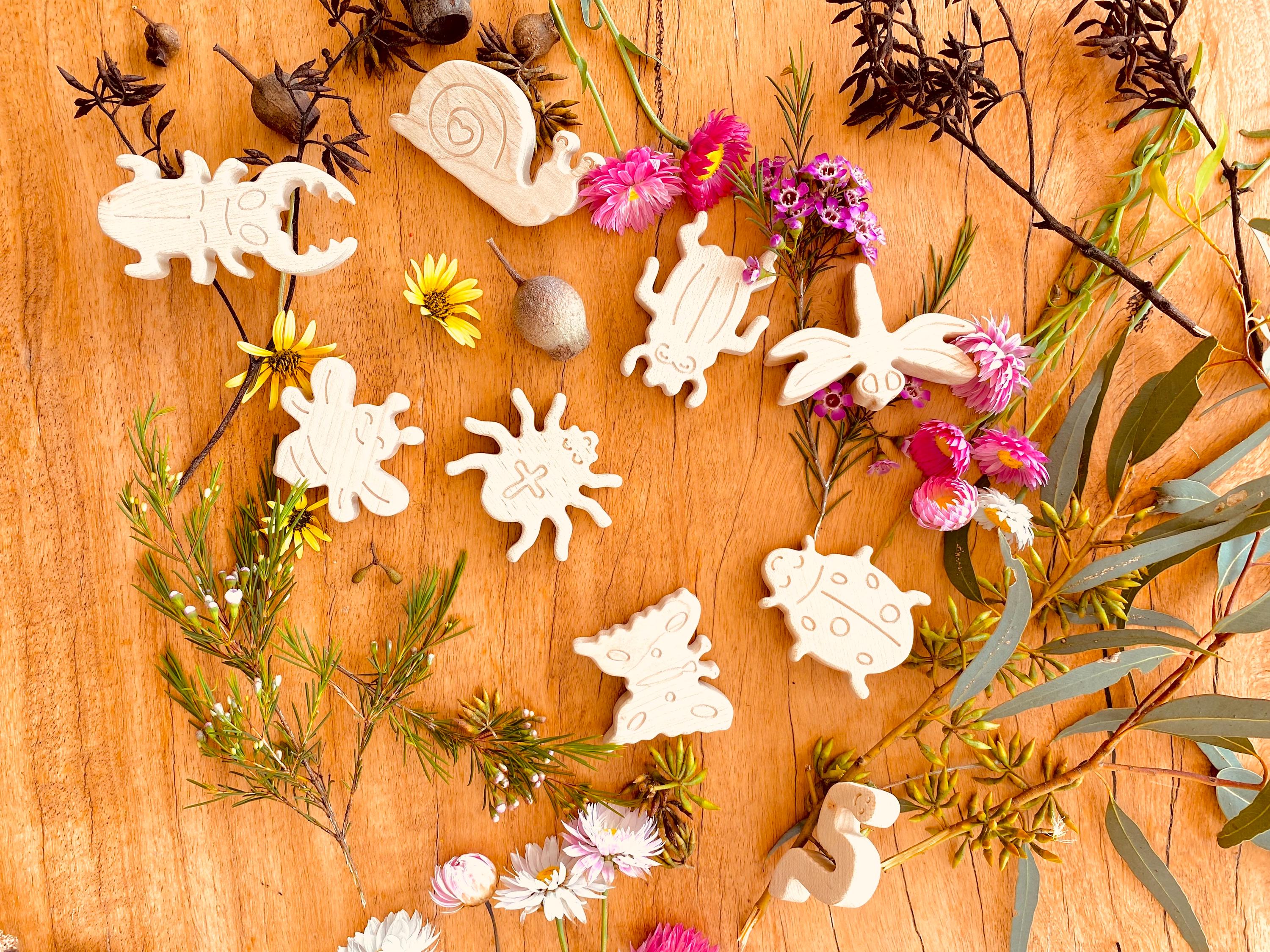 wooden bug toy set: 9-piece collection of wooden insects for nature-themed play.