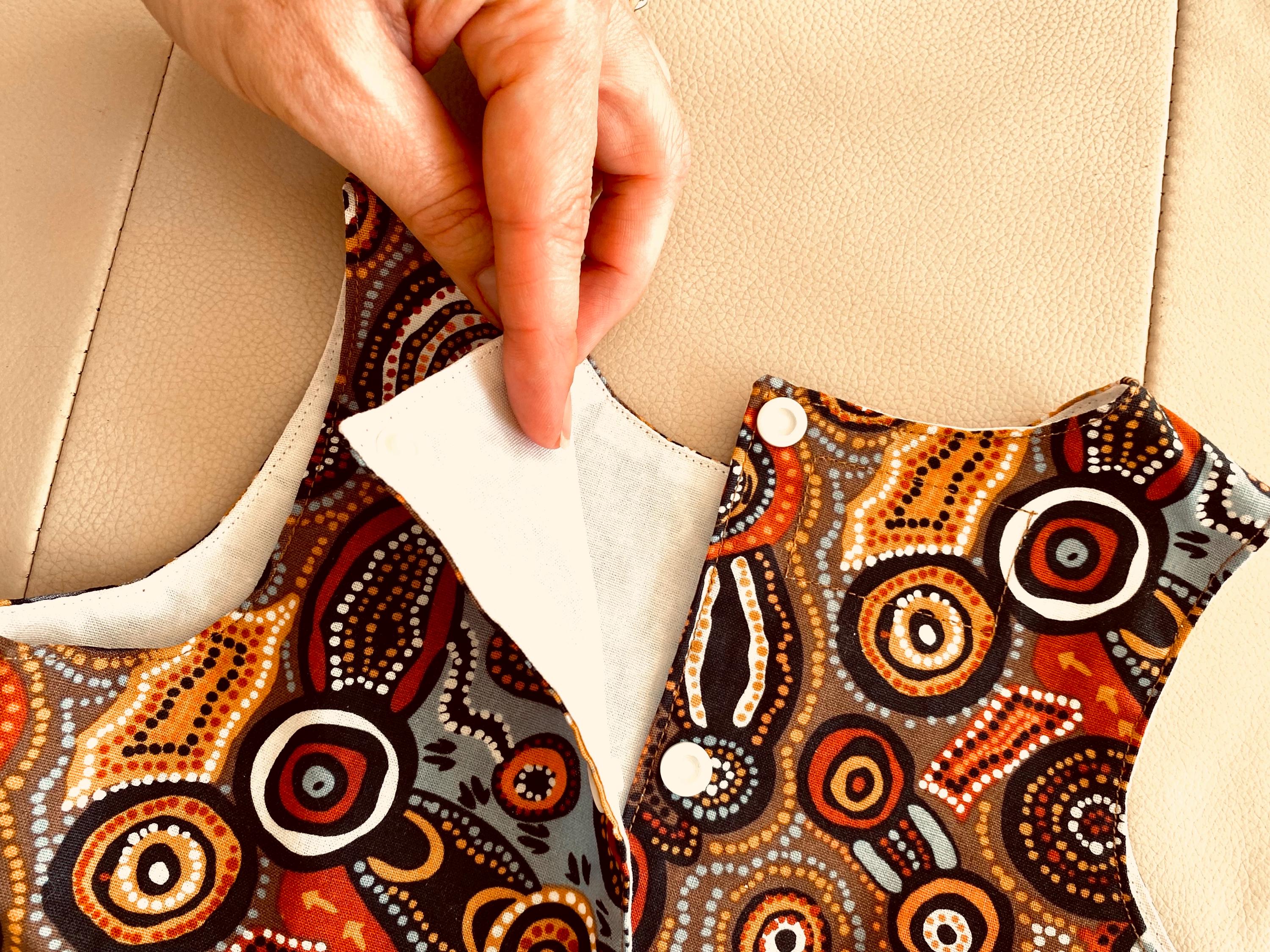 Desert Wind Dress: Girls’ dress made with Indigenous fabric and artistic design.
