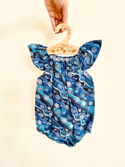 Handmade Desert Tracks Playsuit: Indigenous-inspired cotton playsuit with desert tracks pattern, handmade in Western Australia.