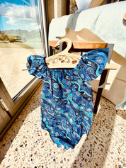 Handmade Desert Tracks Playsuit: Indigenous-inspired cotton playsuit with desert tracks pattern, handmade in Western Australia.