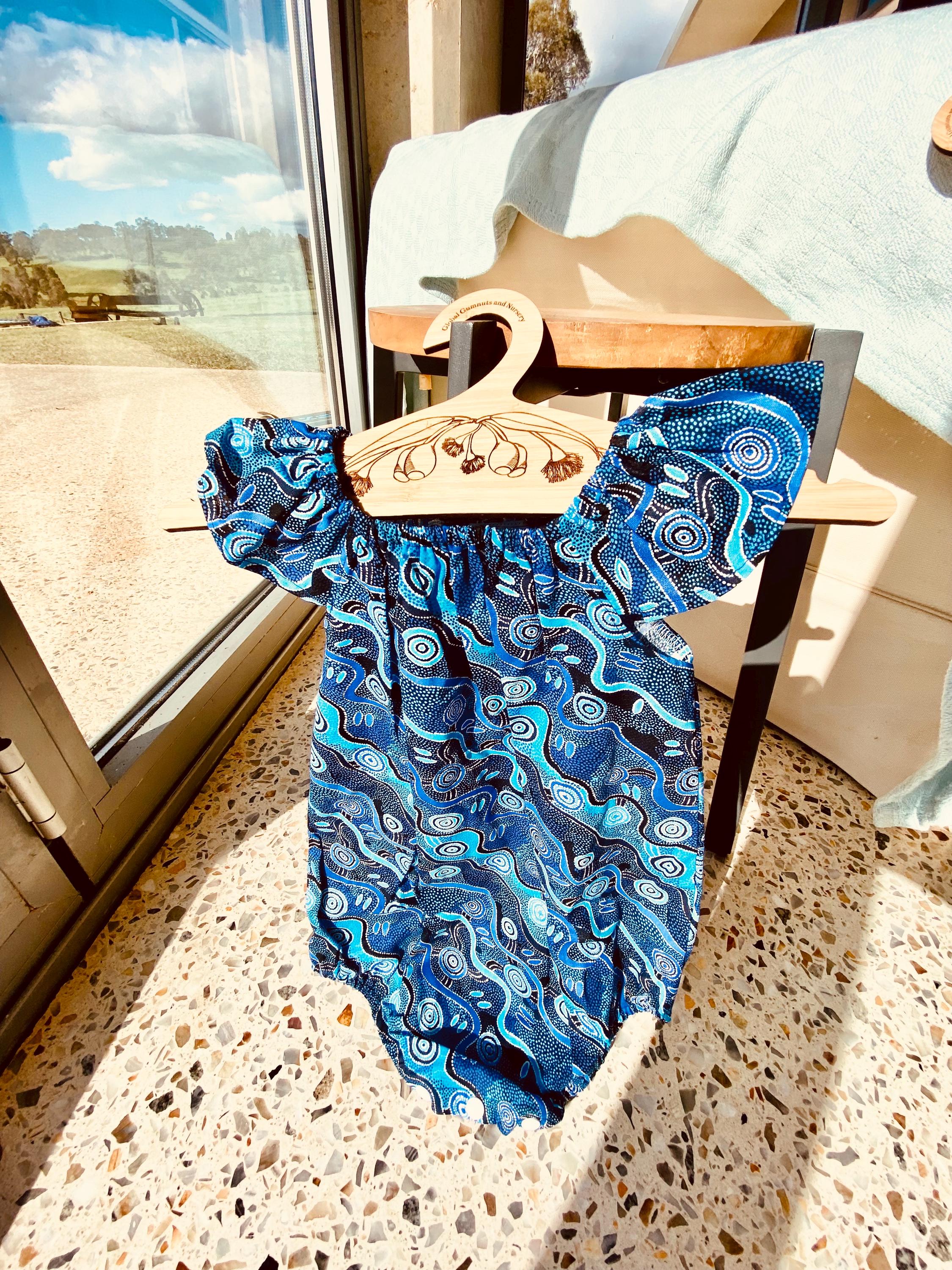 Handmade Desert Tracks Playsuit: Indigenous-inspired cotton playsuit with desert tracks pattern, handmade in Western Australia.