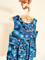 Wooden coat hanger featuring gumnuts and eucalyptus designs, bringing a touch of Australian nature to your closet.