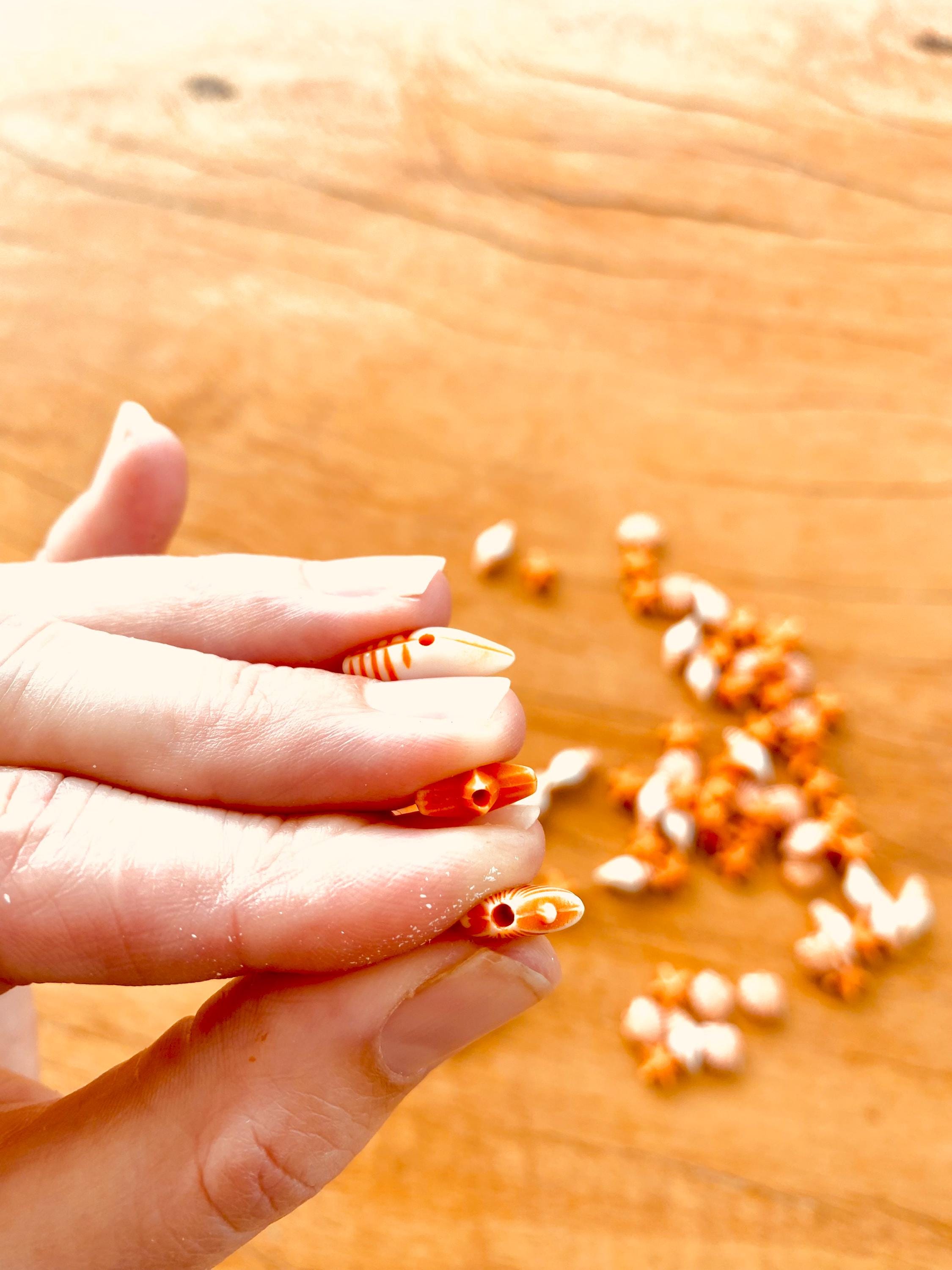 Orange and white starfish & shell beads coastal crafting kit, ideal for creative beach-themed projects.