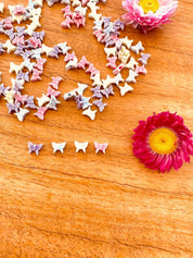 Butterfly bead set in pink, green, purple, and blue. Great for creative jewelry projects and kids' crafts.