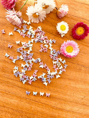 Butterfly bead set in pink, green, purple, and blue. Great for creative jewelry projects and kids' crafts.