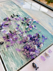 Purple and silver butterfly beads with purple crystals or black, white, and silver fish beads with clear crystals, an elegant ocean bead set.