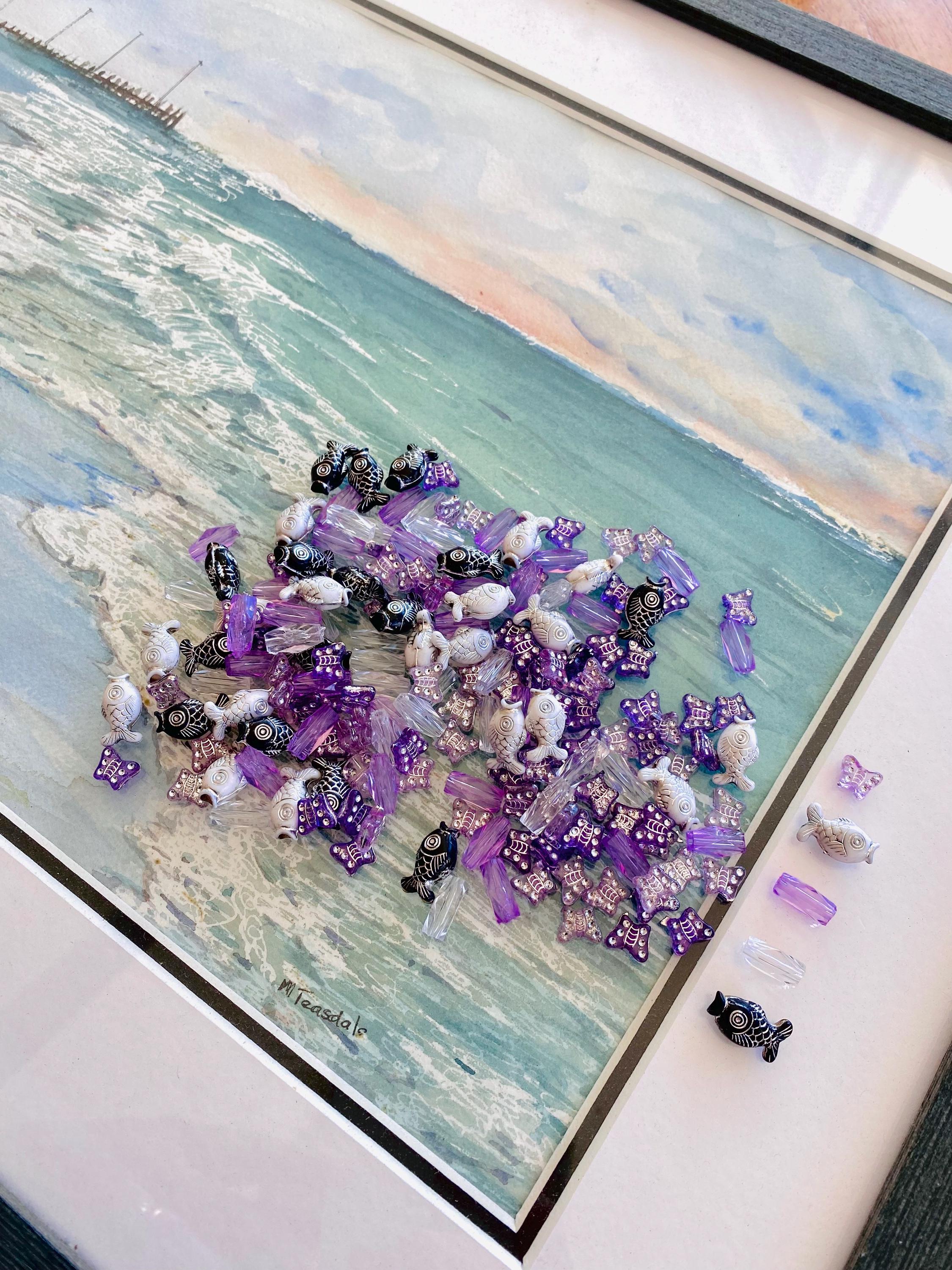 Purple and silver butterfly beads with purple crystals or black, white, and silver fish beads with clear crystals, an elegant ocean bead set.