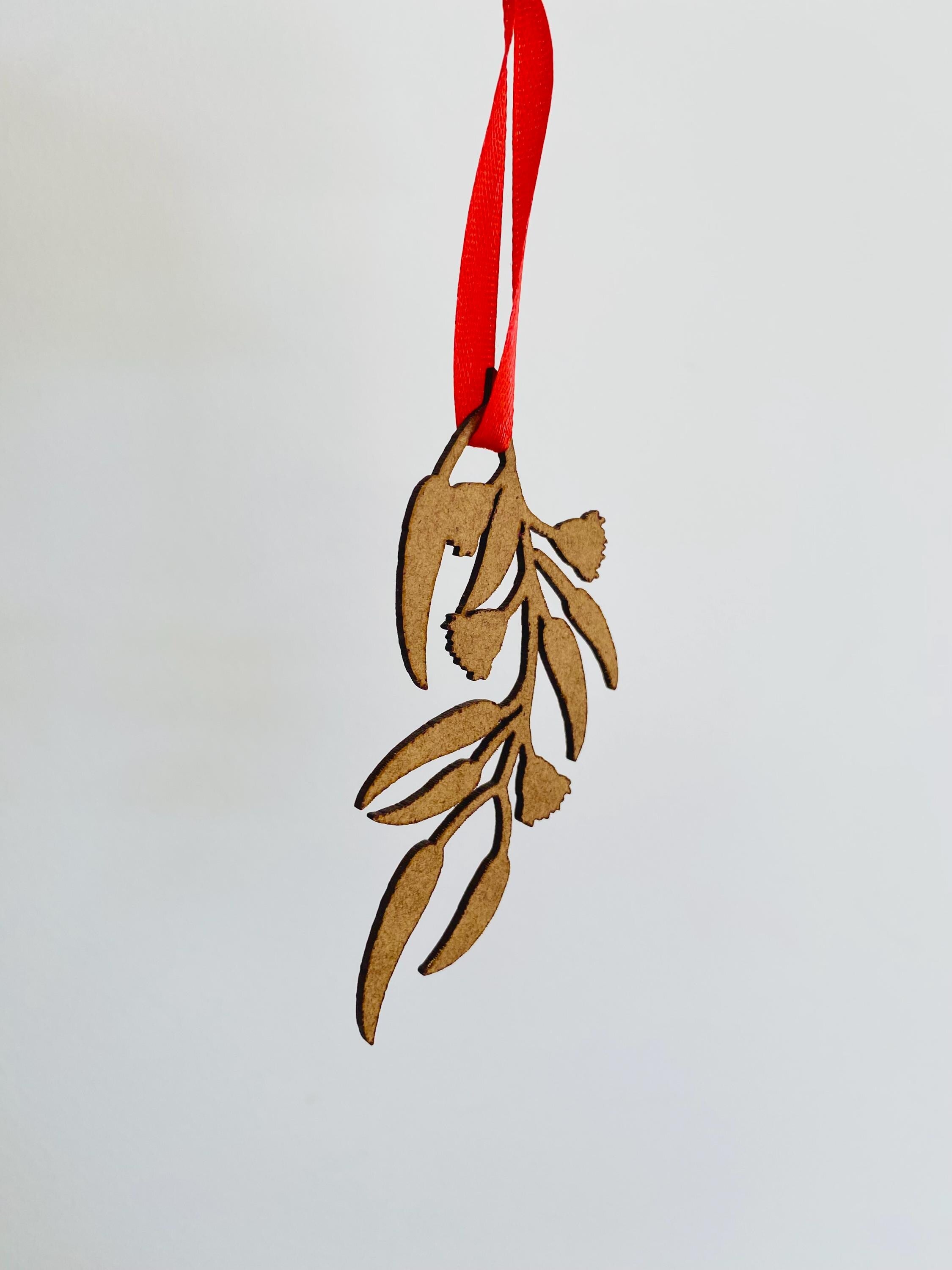 Eucalyptus Branch Ornament: Eucalyptus-themed ornament for festive displays.