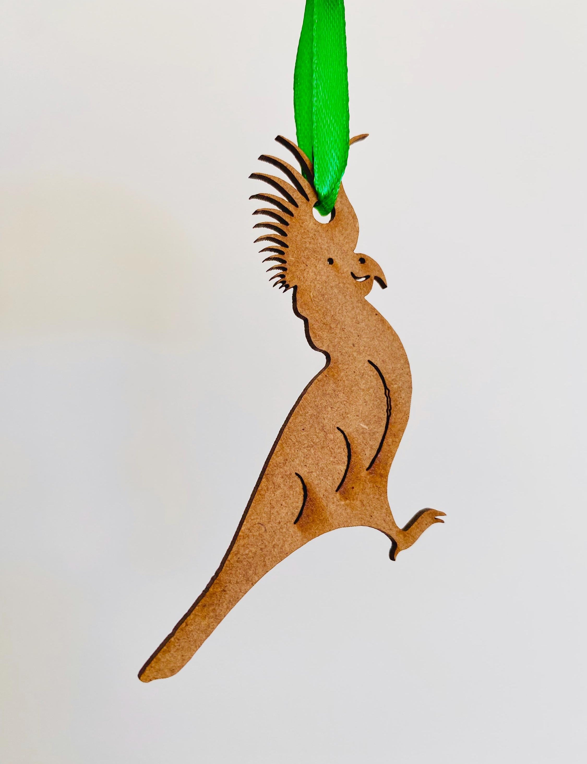 Cockatoo Ornament: Wooden ornament of a cockatoo for Christmas decorations.