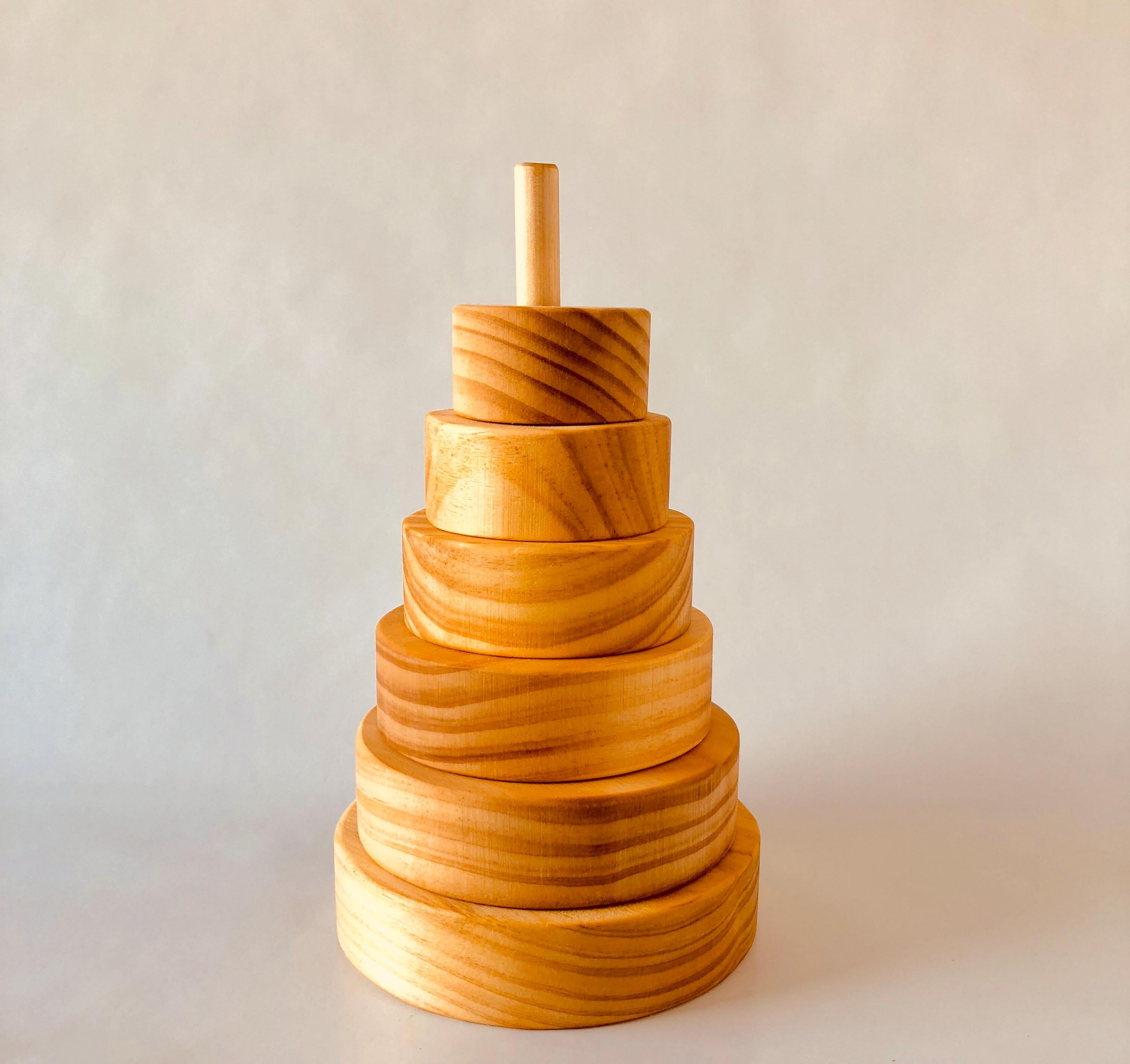Natural Wooden Stacker: Customizable stacker with a personalized name option.