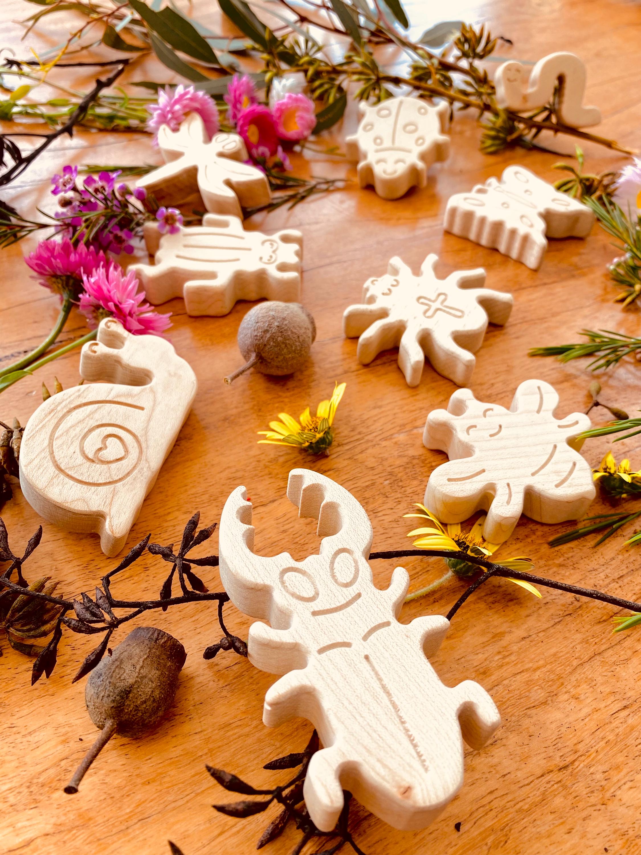 wooden bug toy set: 9-piece collection of wooden insects for nature-themed play.