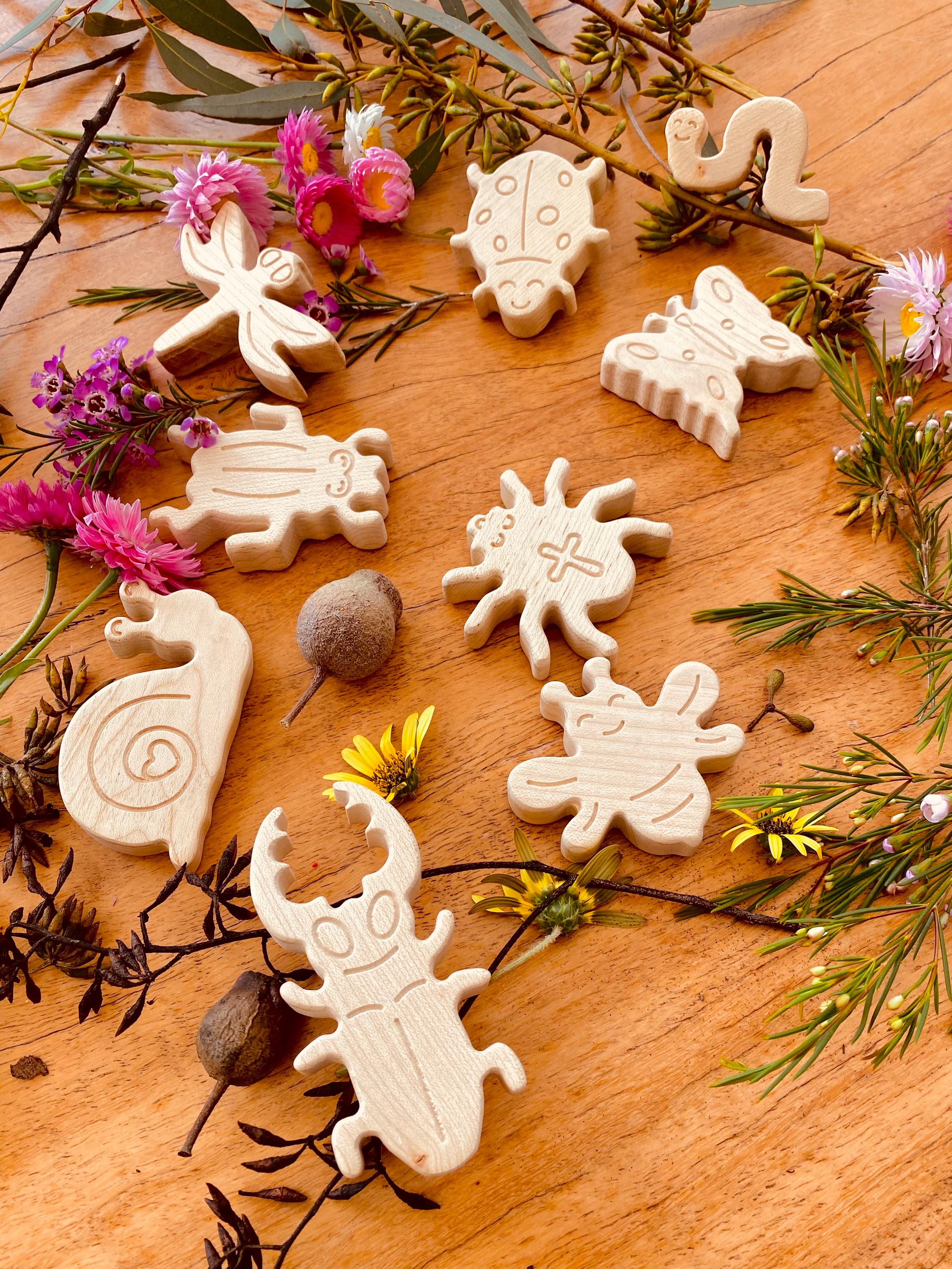 wooden bug toy set: 9-piece collection of wooden insects for nature-themed play.