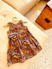 Desert Wind Dress: Girls’ dress made with Indigenous fabric and artistic design.
