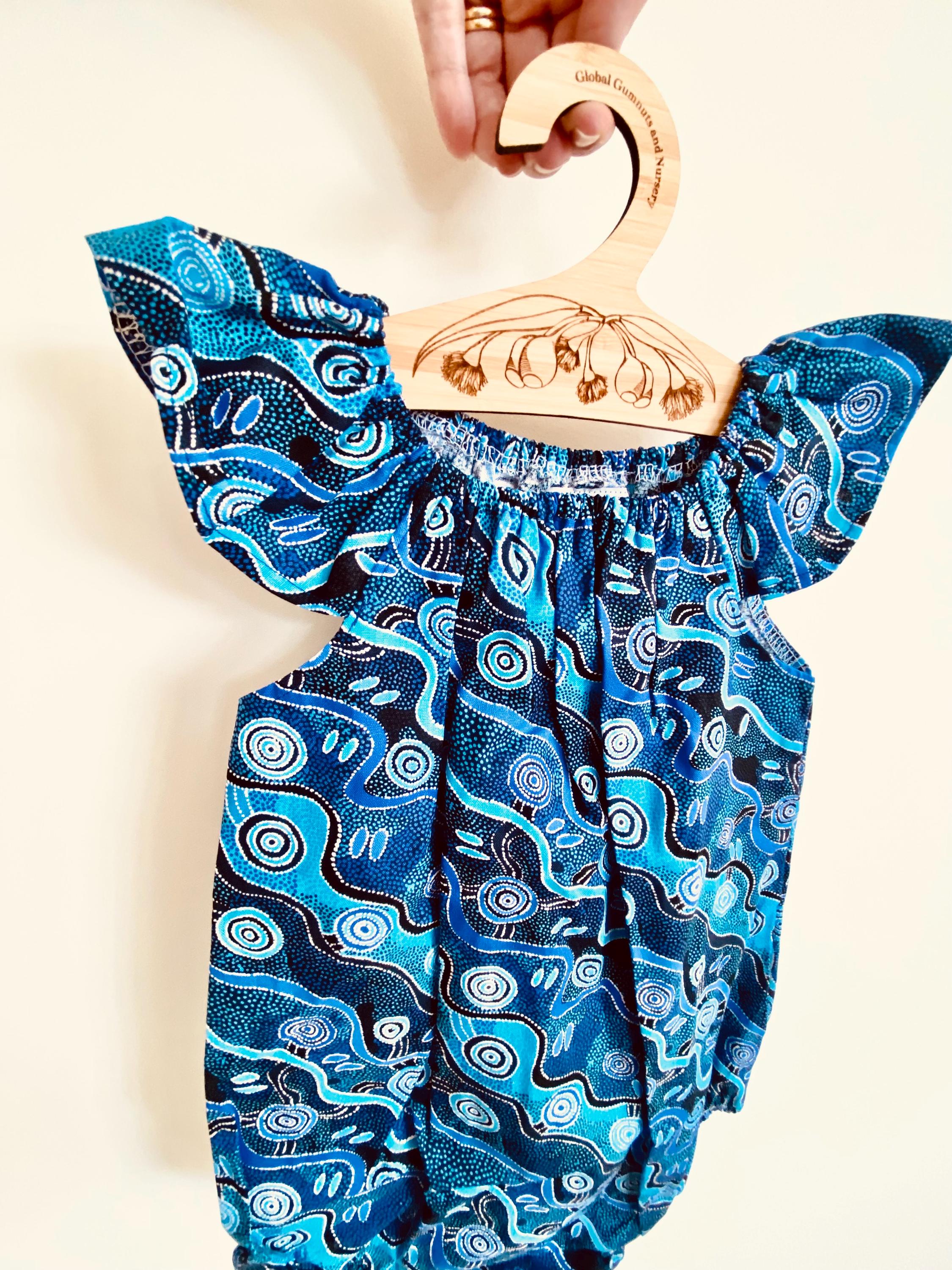 Handmade Desert Tracks Playsuit: Indigenous-inspired cotton playsuit with desert tracks pattern, handmade in Western Australia.