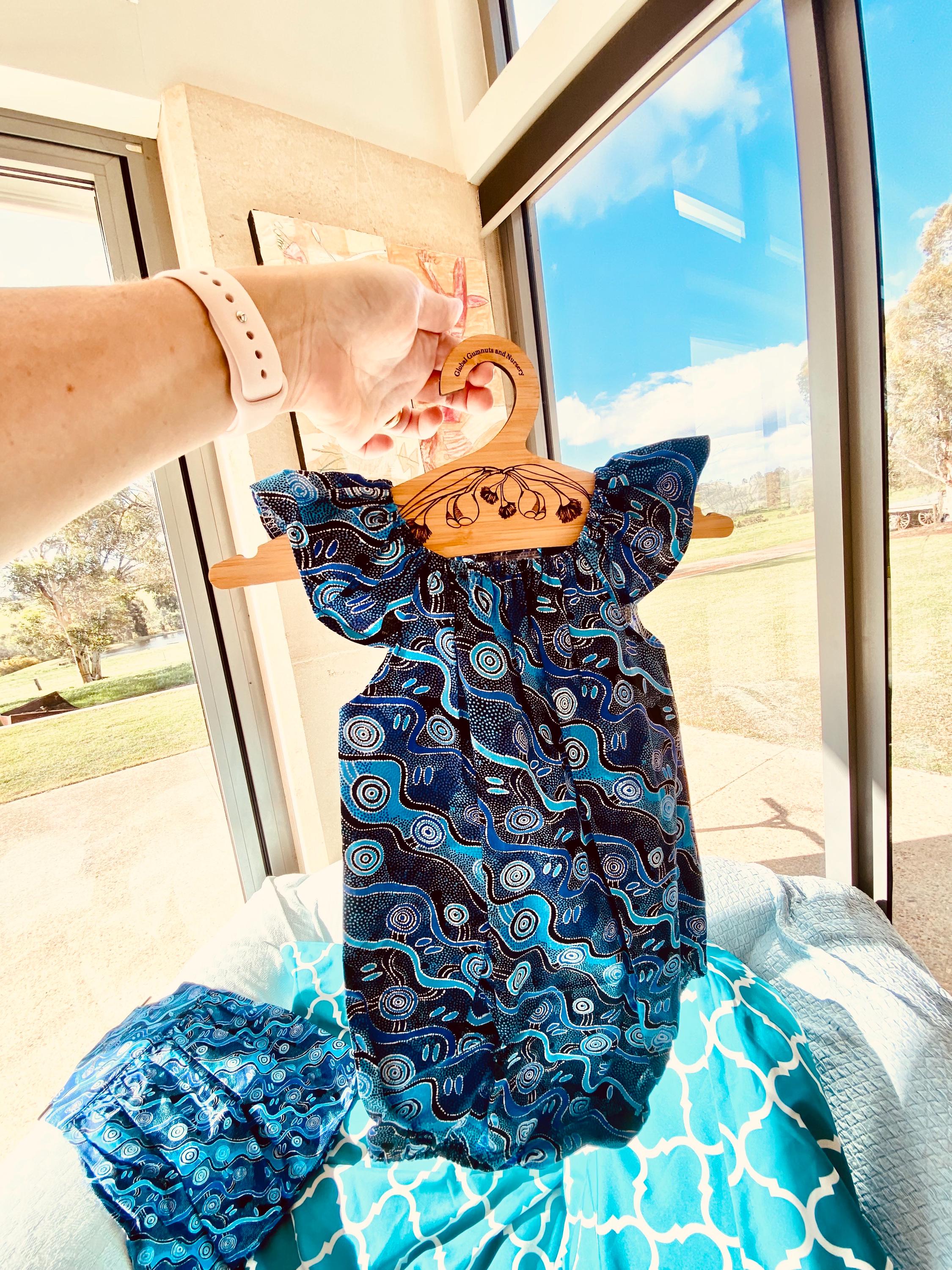 Handmade Desert Tracks Playsuit: Indigenous-inspired cotton playsuit with desert tracks pattern, handmade in Western Australia.
