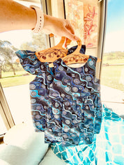 Wooden coat hanger featuring gumnuts and eucalyptus designs, bringing a touch of Australian nature to your closet.