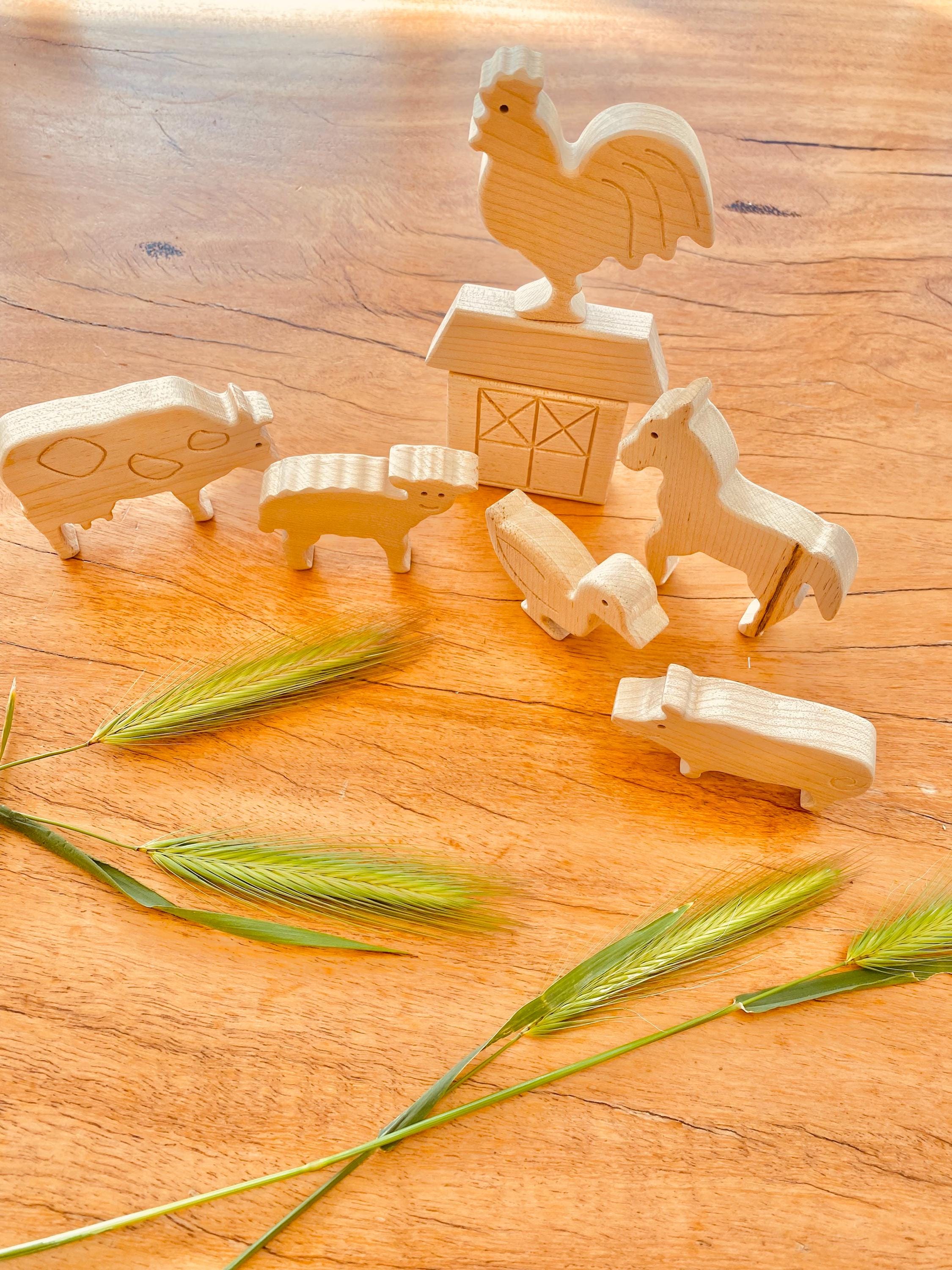 Unpainted birchwood farm animal set, an 8-piece Montessori toy perfect for creative play and crafting.