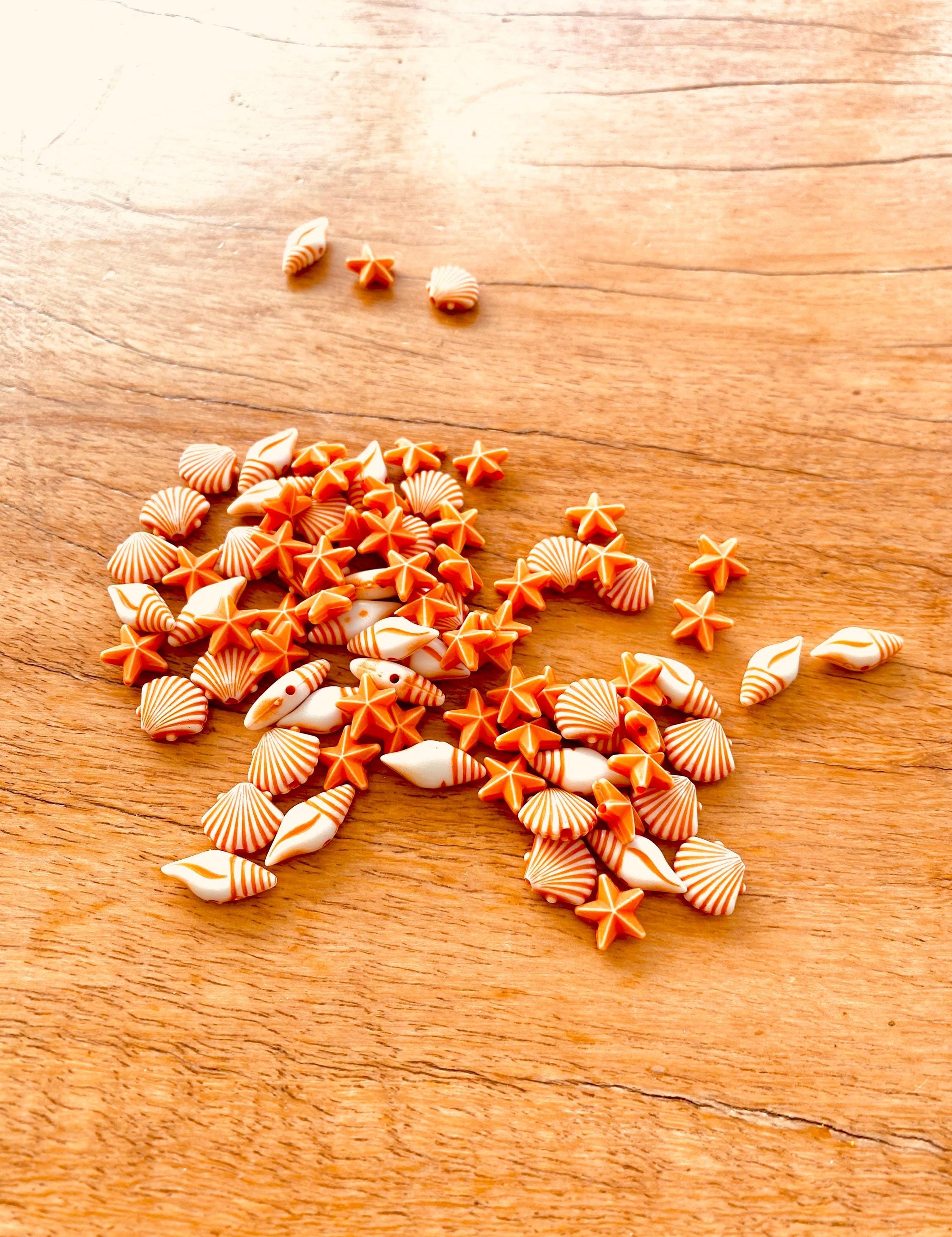 Orange and white starfish & shell beads coastal crafting kit, ideal for creative beach-themed projects.
