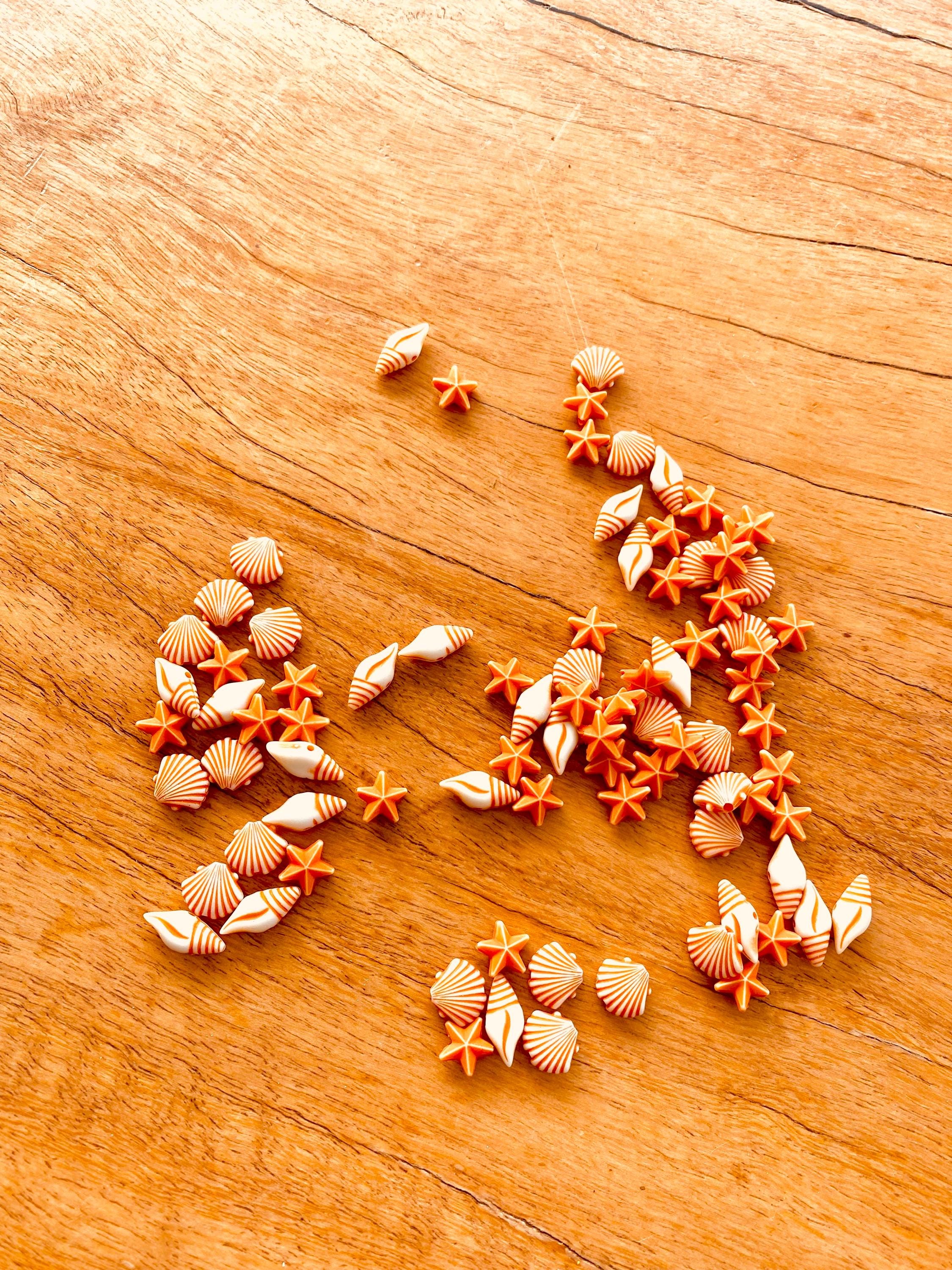 Orange and white starfish & shell beads coastal crafting kit, ideal for creative beach-themed projects.