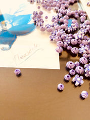 Purple flowers and round beads floral craft bead set, perfect for creative projects.