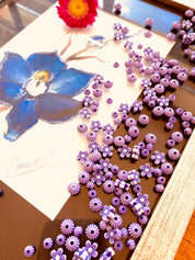 Purple flowers and round beads floral craft bead set, perfect for creative projects.