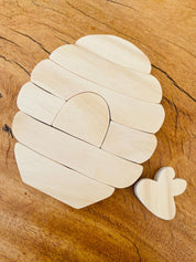 Natural beehive wooden stacker and bee life cycle puzzle, a fun educational toy.