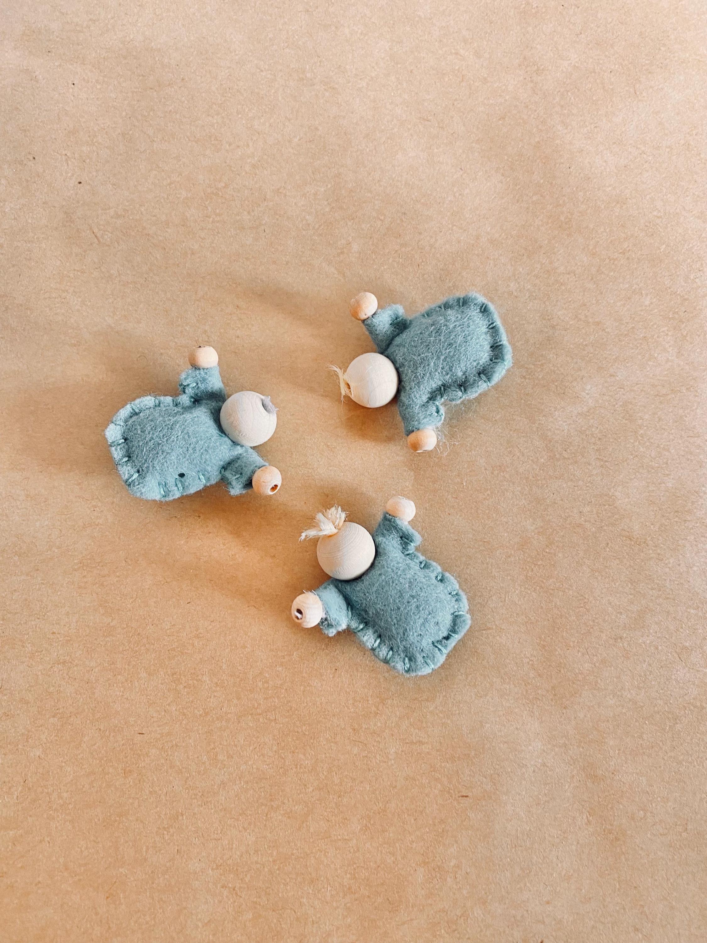 Tiny felt worry dolls, comforting companions designed to help children with big worries.