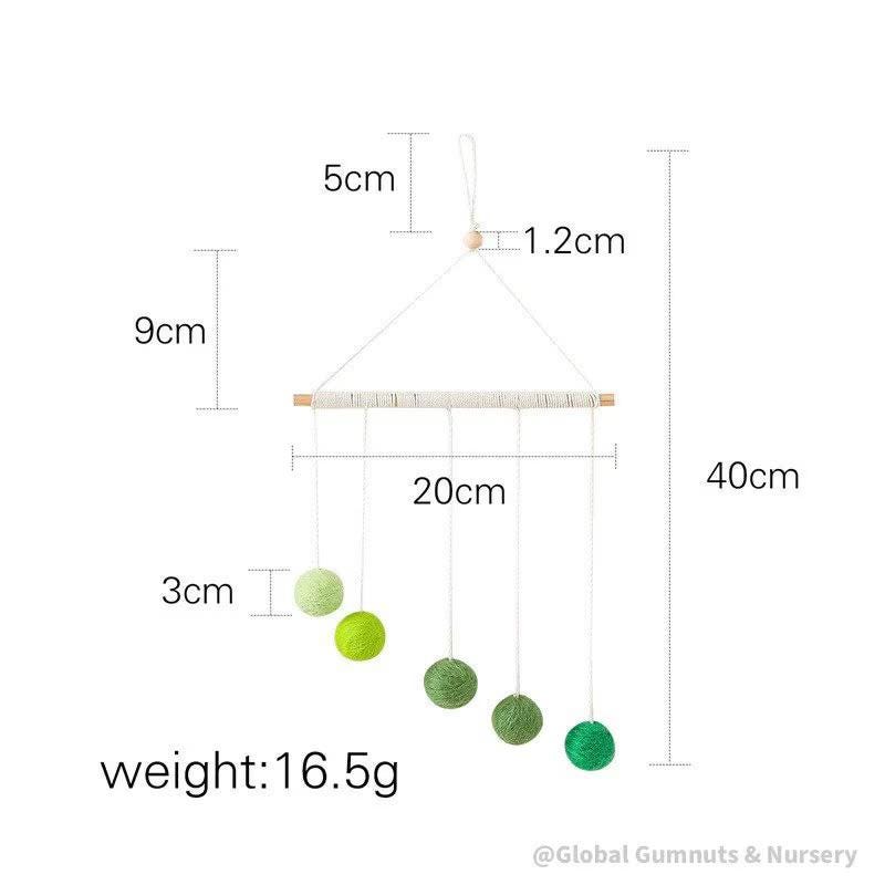 Montessori-inspired color bar baby mobile in pink, an eco-friendly and soothing nursery decor.
