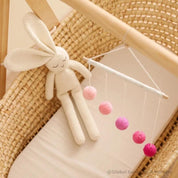 Montessori-inspired color bar baby mobile in pink, an eco-friendly and soothing nursery decor.
