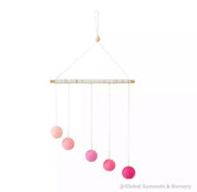 Montessori-inspired color bar baby mobile in pink, an eco-friendly and soothing nursery decor.
