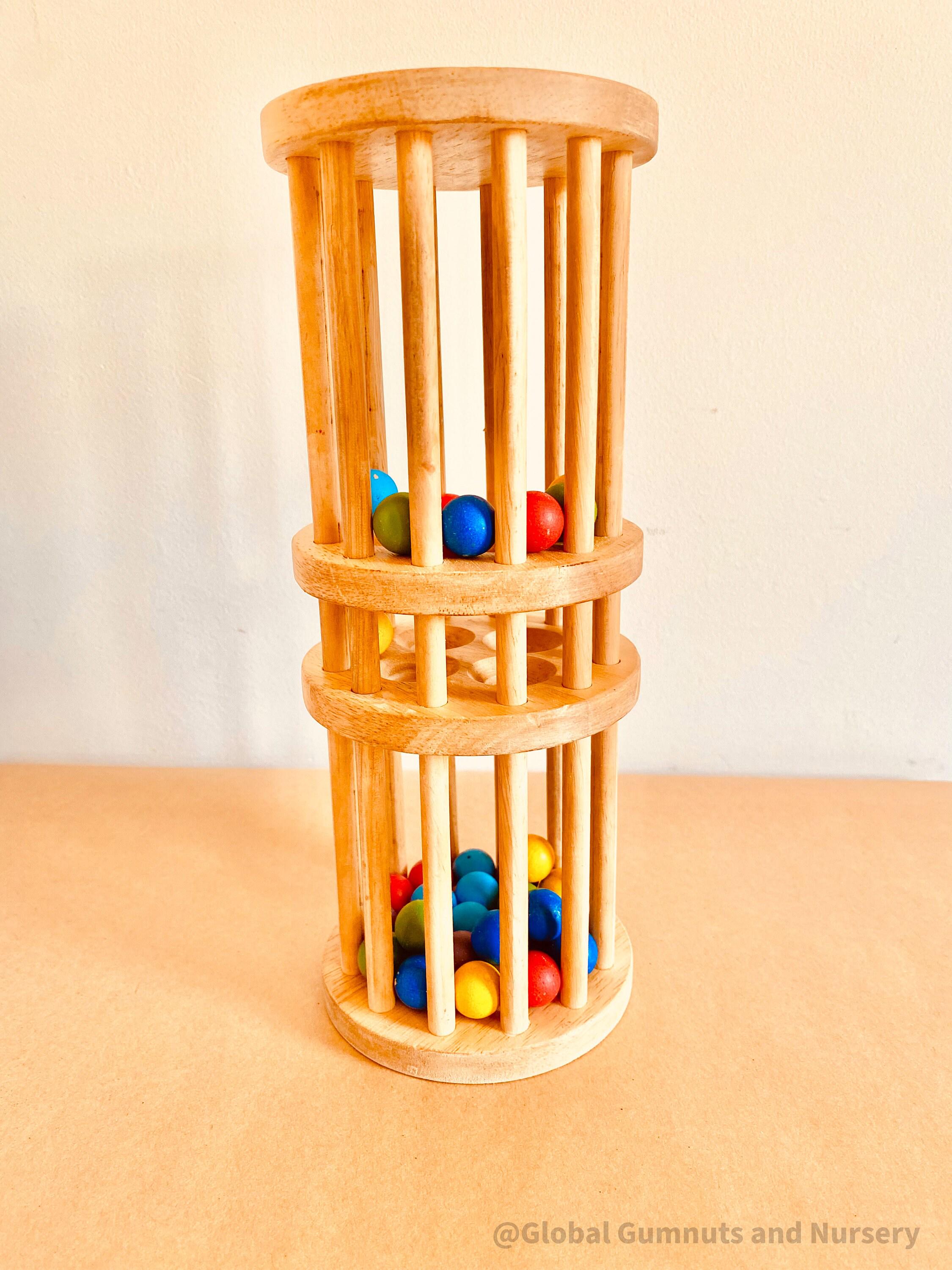 Wooden rainmaker toy in two sizes, a magical sensory and musical toy for kids.