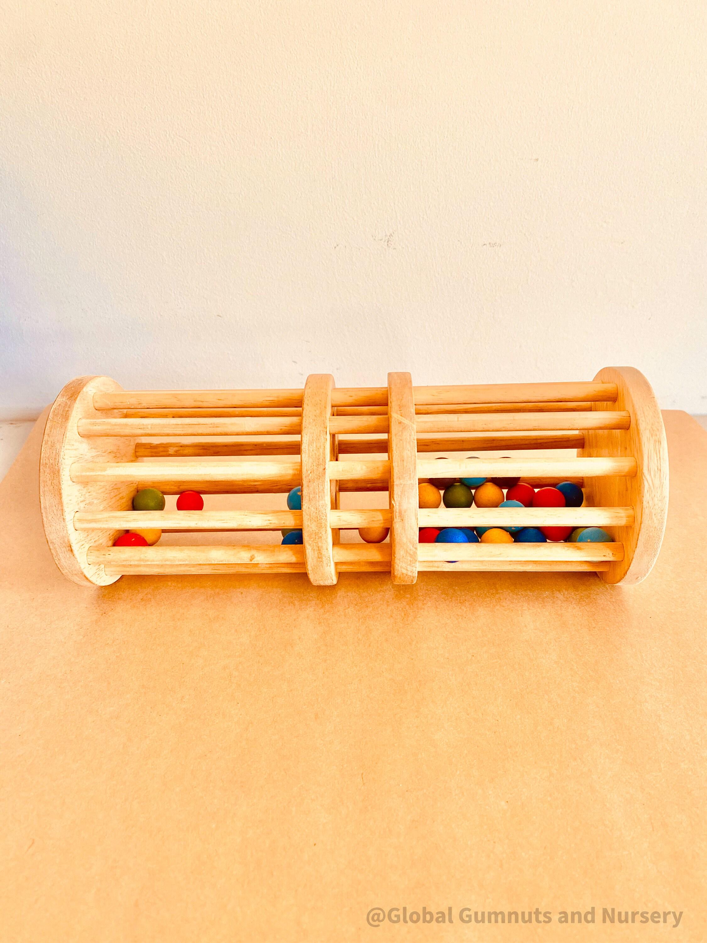 Wooden rainmaker toy in two sizes, a magical sensory and musical toy for kids.