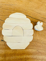 Natural beehive wooden stacker and bee life cycle puzzle, a fun educational toy.
