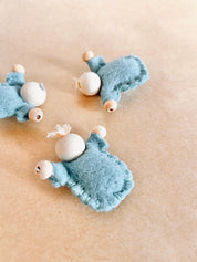 Tiny felt worry dolls, comforting companions designed to help children with big worries.