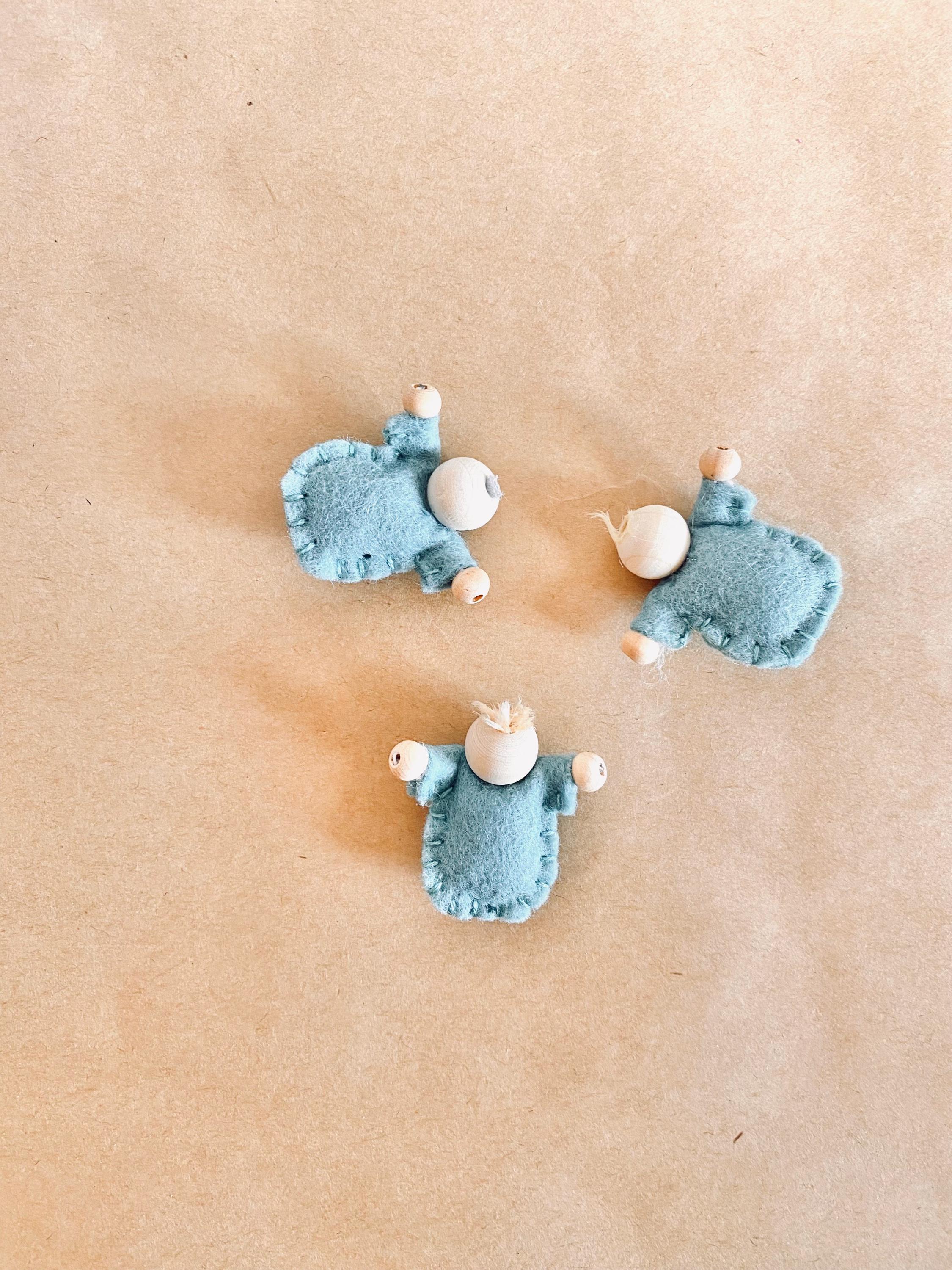 Tiny felt worry dolls, comforting companions designed to help children with big worries.