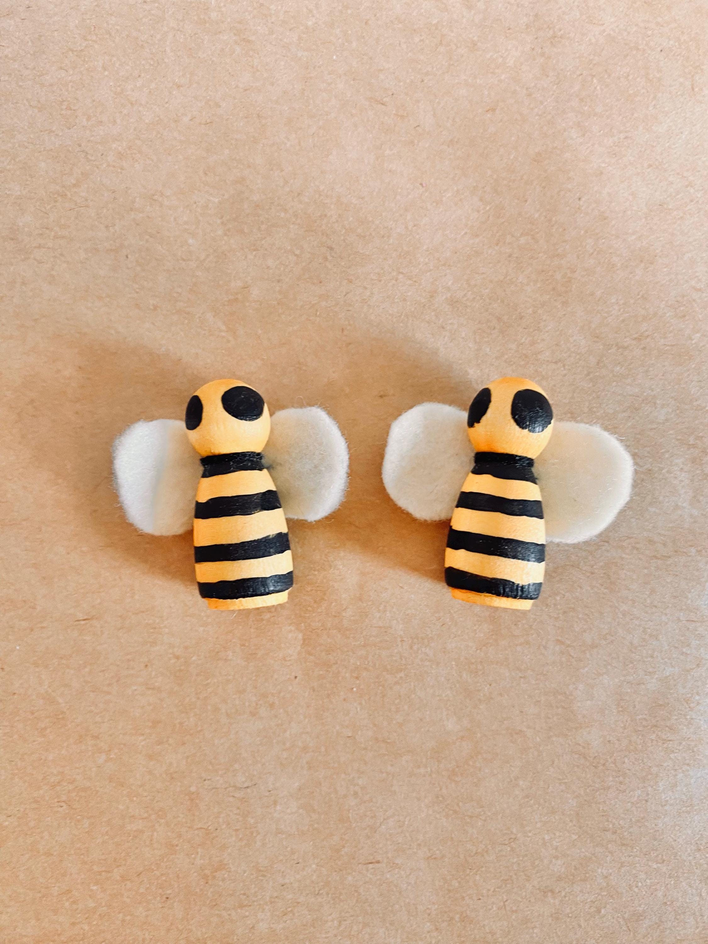 Handcrafted wooden bees with felt wings (3cm), a limited-edition piece for whimsical decor or creative play.
