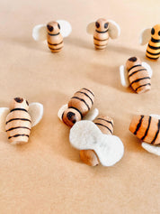 Handcrafted wooden bees with felt wings (3cm), a limited-edition piece for whimsical decor or creative play.