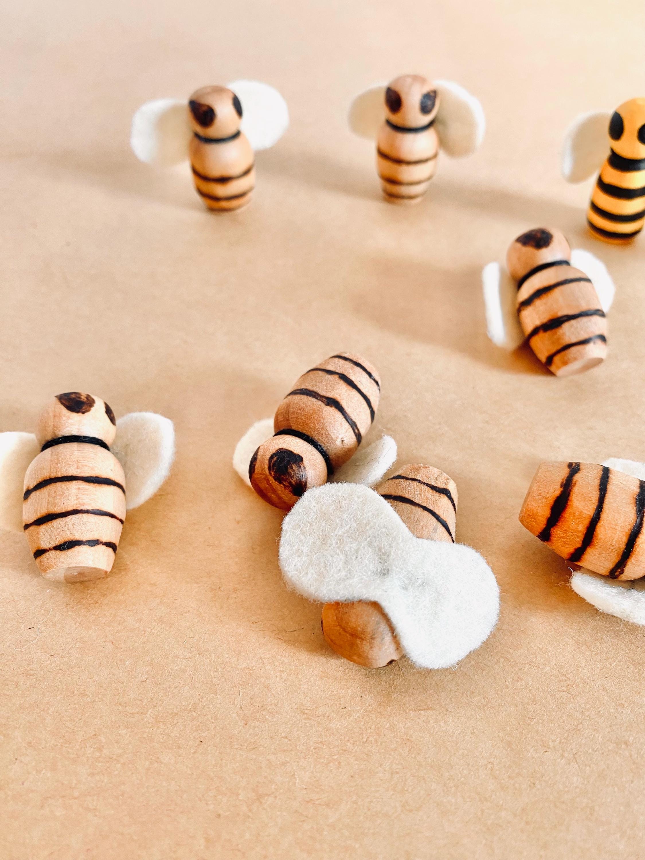 Handcrafted wooden bees with felt wings (3cm), a limited-edition piece for whimsical decor or creative play.