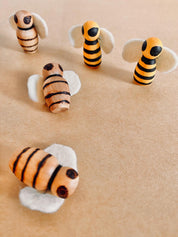 Handcrafted wooden bees with felt wings (3cm), a limited-edition piece for whimsical decor or creative play.