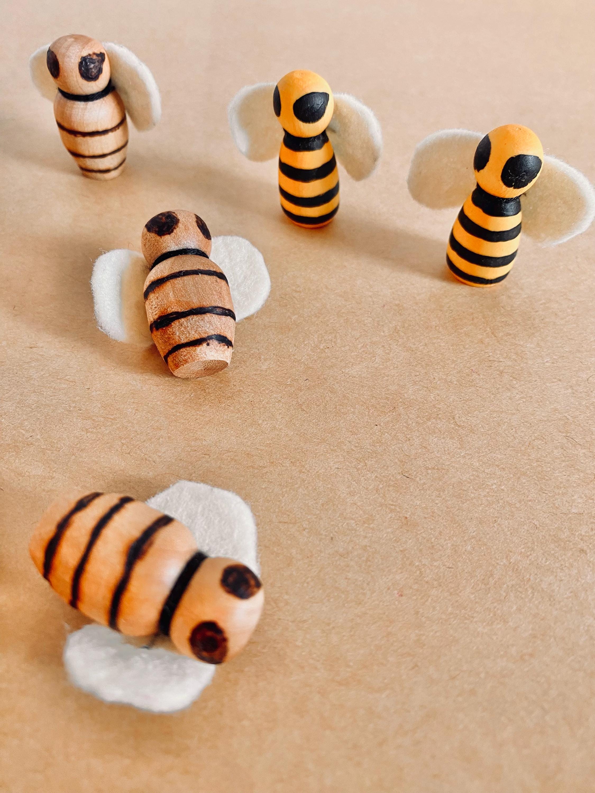 Handcrafted wooden bees with felt wings (3cm), a limited-edition piece for whimsical decor or creative play.