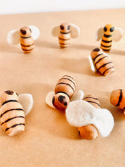 Handcrafted wooden bees with felt wings (3cm), a limited-edition piece for whimsical decor or creative play.