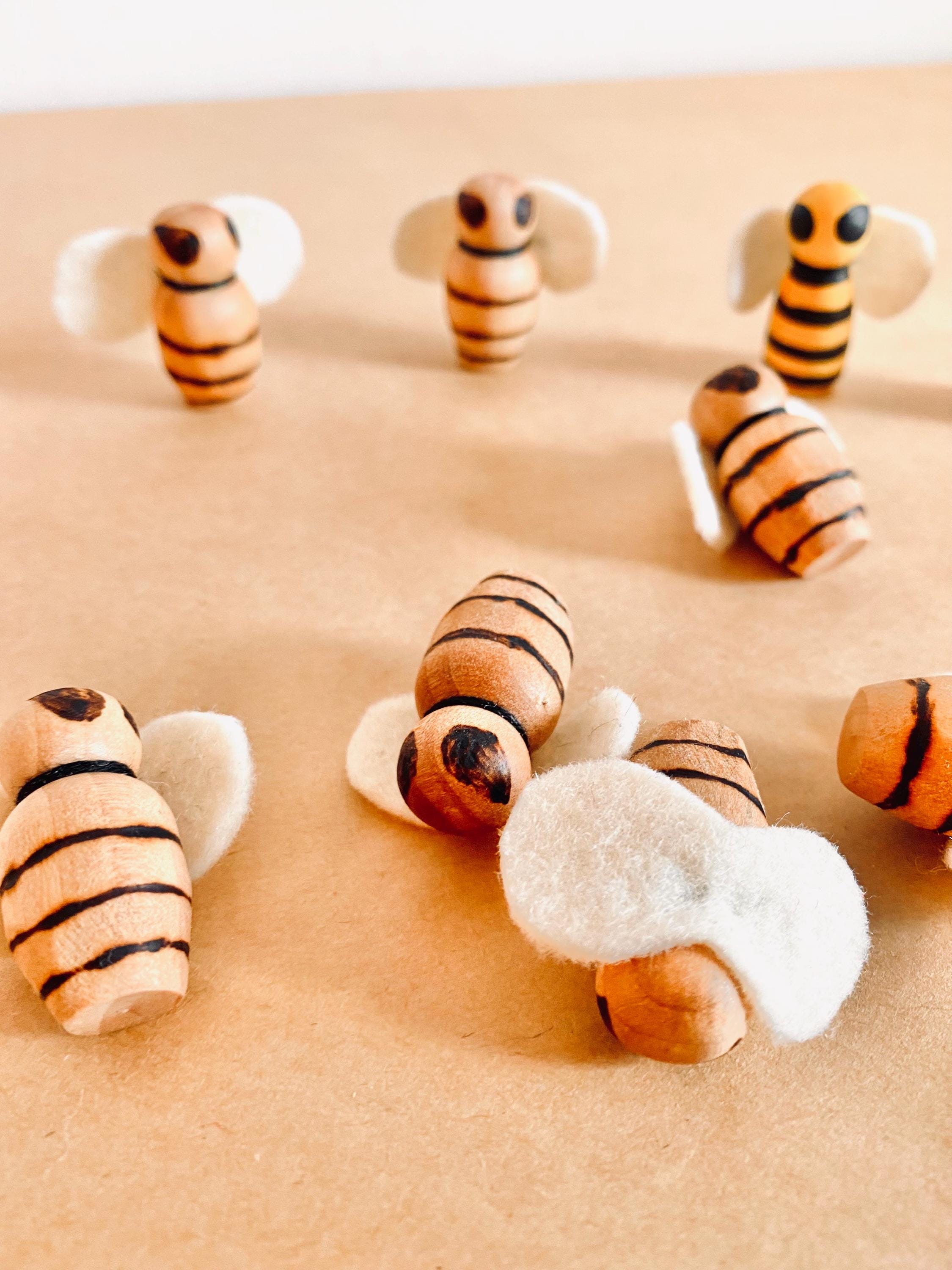 Handcrafted wooden bees with felt wings (3cm), a limited-edition piece for whimsical decor or creative play.