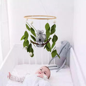 Handcrafted koala baby mobile with an Australian theme, a unique nursery decor piece for newborns.
