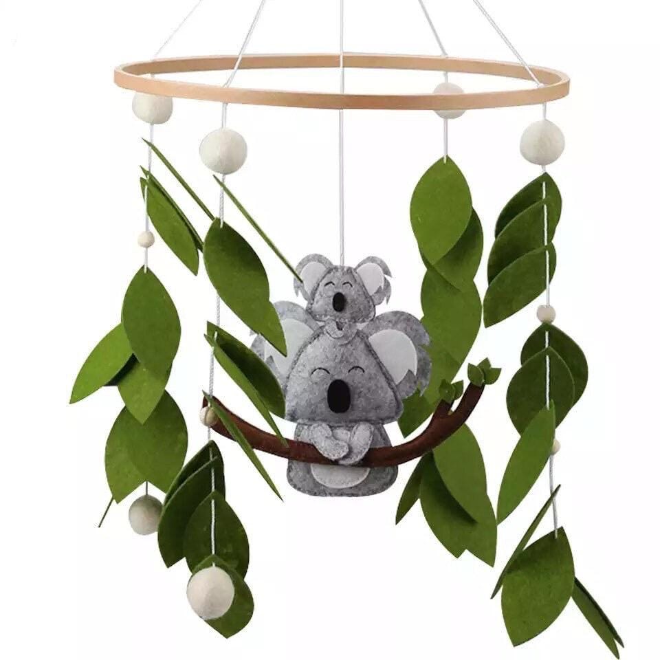 Handcrafted koala baby mobile with an Australian theme, a unique nursery decor piece for newborns.