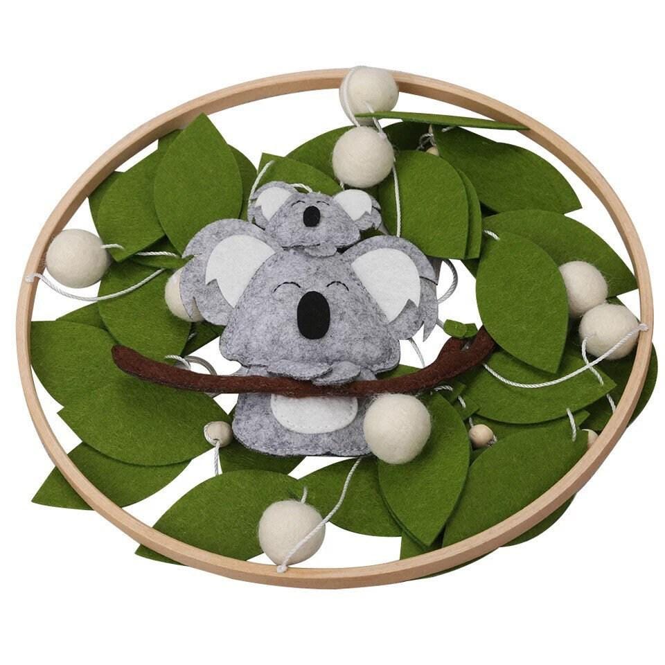 Handcrafted koala baby mobile with an Australian theme, a unique nursery decor piece for newborns.