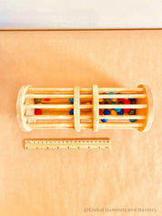 Wooden rainmaker toy in two sizes, a magical sensory and musical toy for kids.