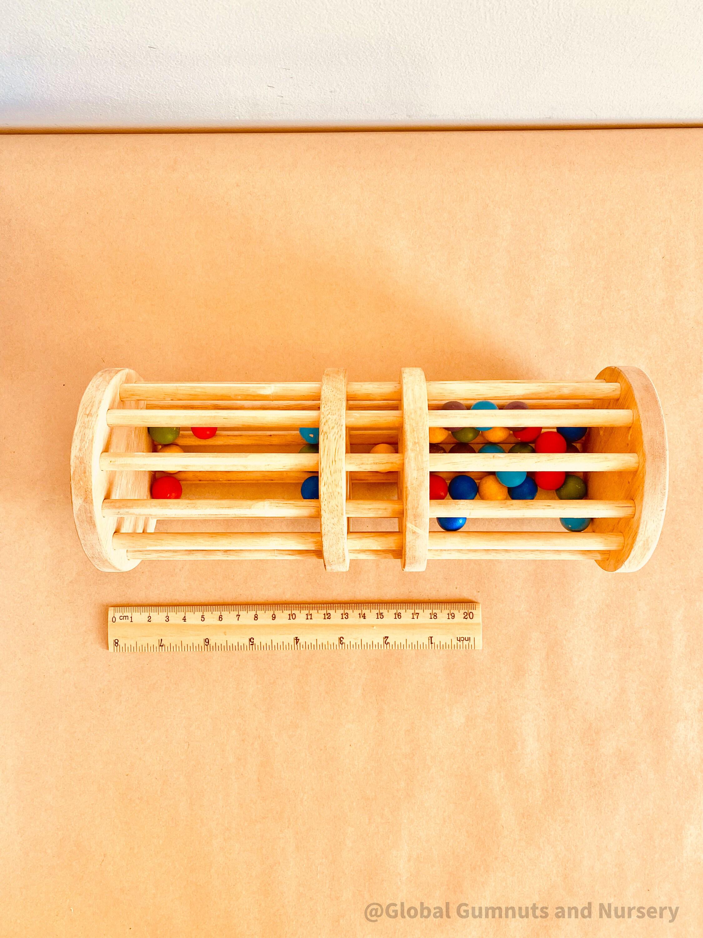 Wooden rainmaker toy in two sizes, a magical sensory and musical toy for kids.