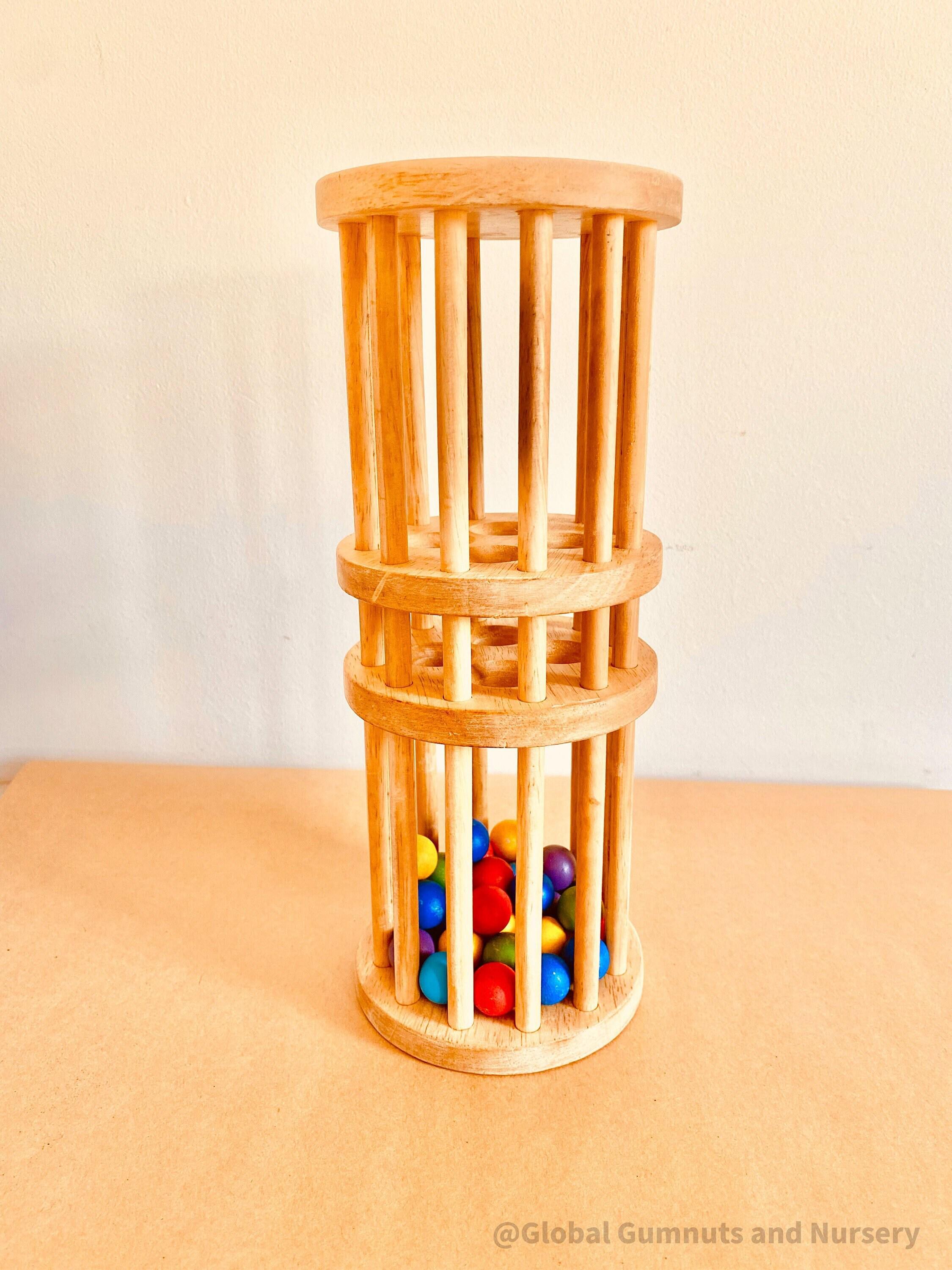 Wooden rainmaker toy in two sizes, a magical sensory and musical toy for kids.
